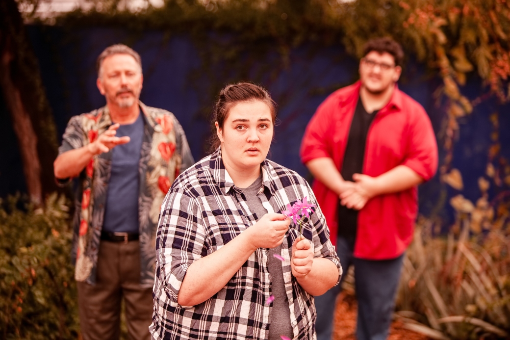 Samantha Severson as Conrad (center), with Tony Caprile as Som and Tyler Gastelum as Dev. Photos courtesy of Winding Road Theater.